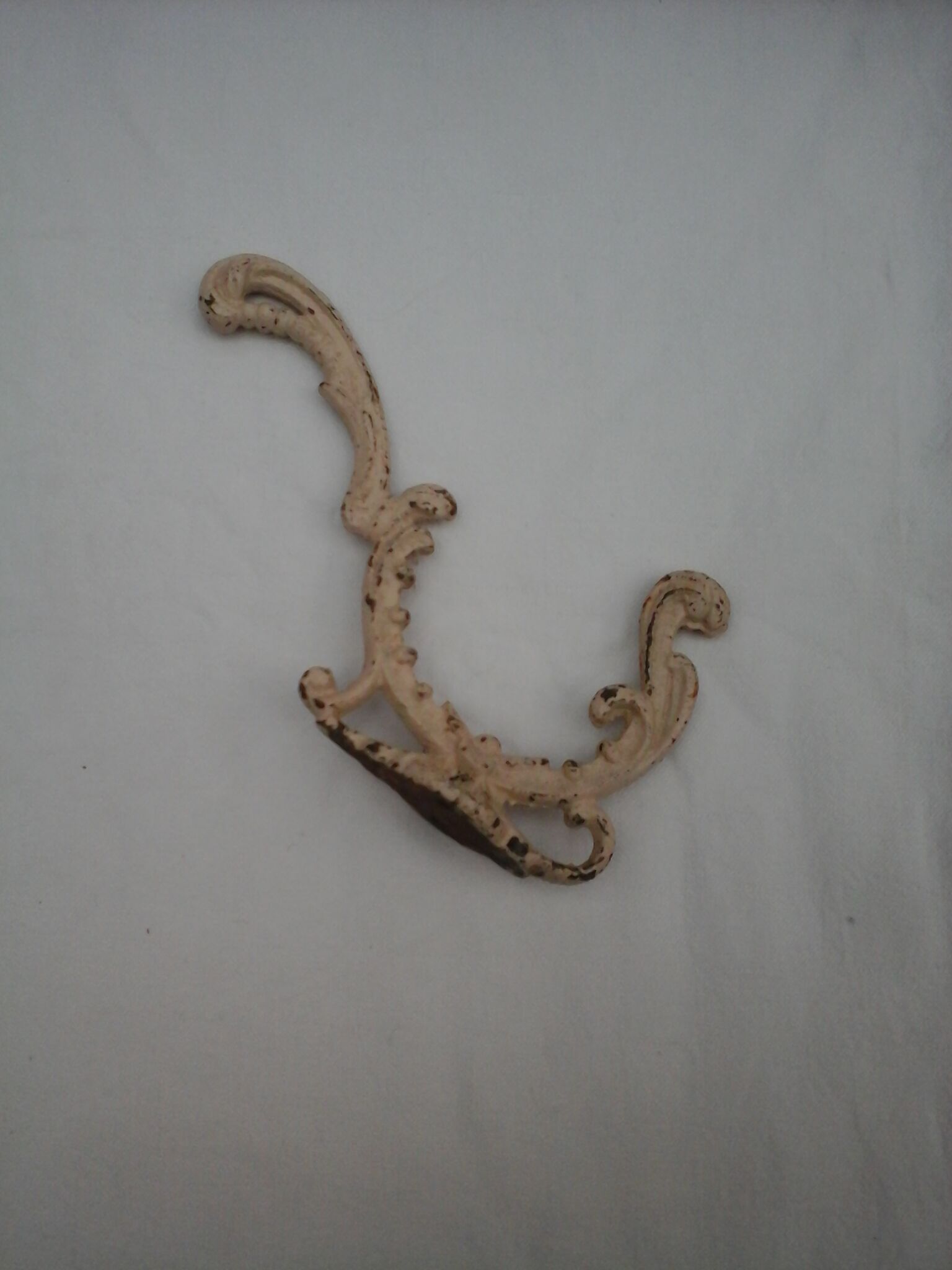 Chiseled cast iron patère