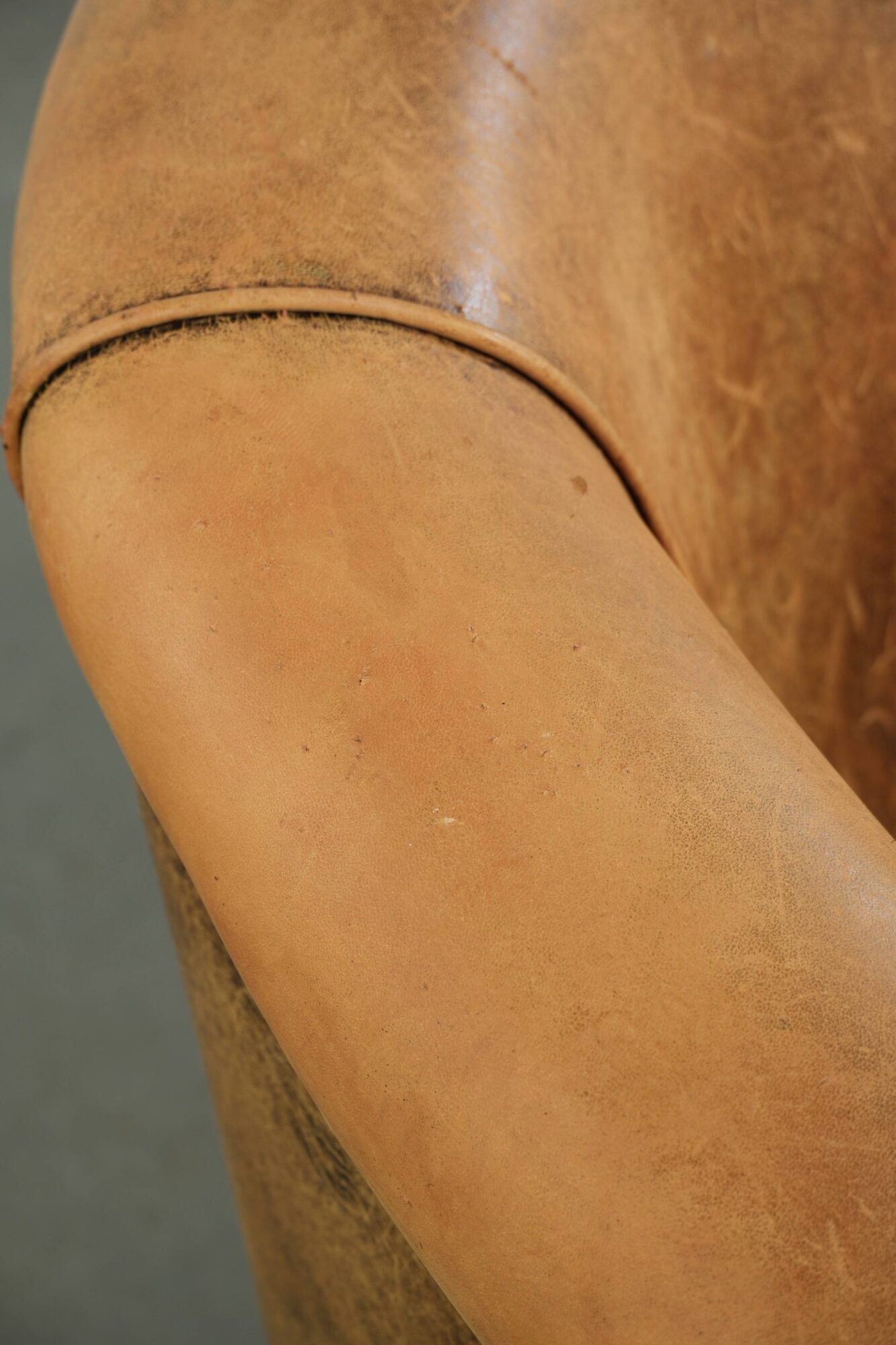 Vintage sheepskin club armchair in a light cognac colour