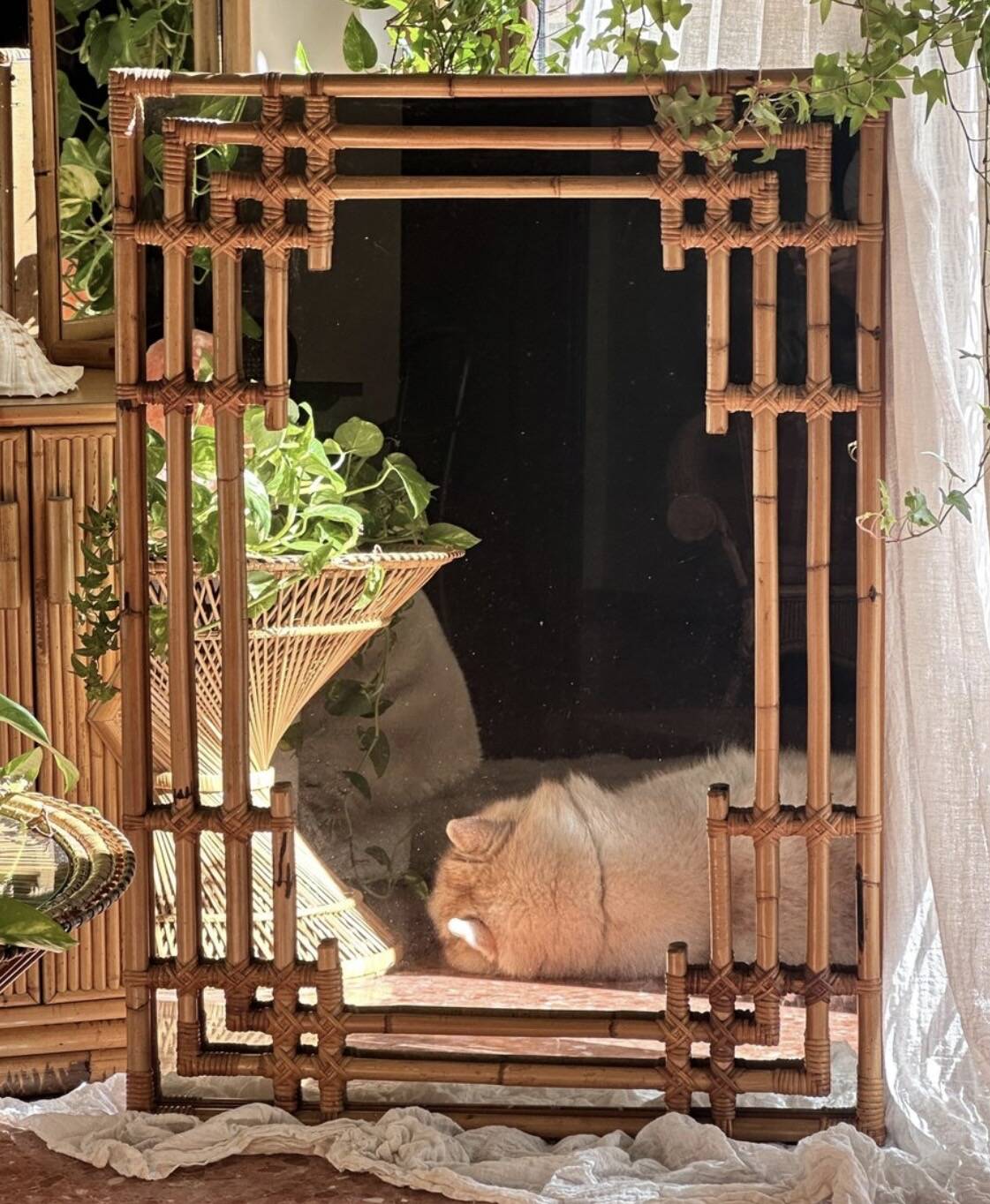 Large sculptural mirror handmade from natural bamboo and woven rattan, 1960.
