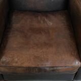 Set of two vintage sheepskin leather design armchairs in a cognac colour