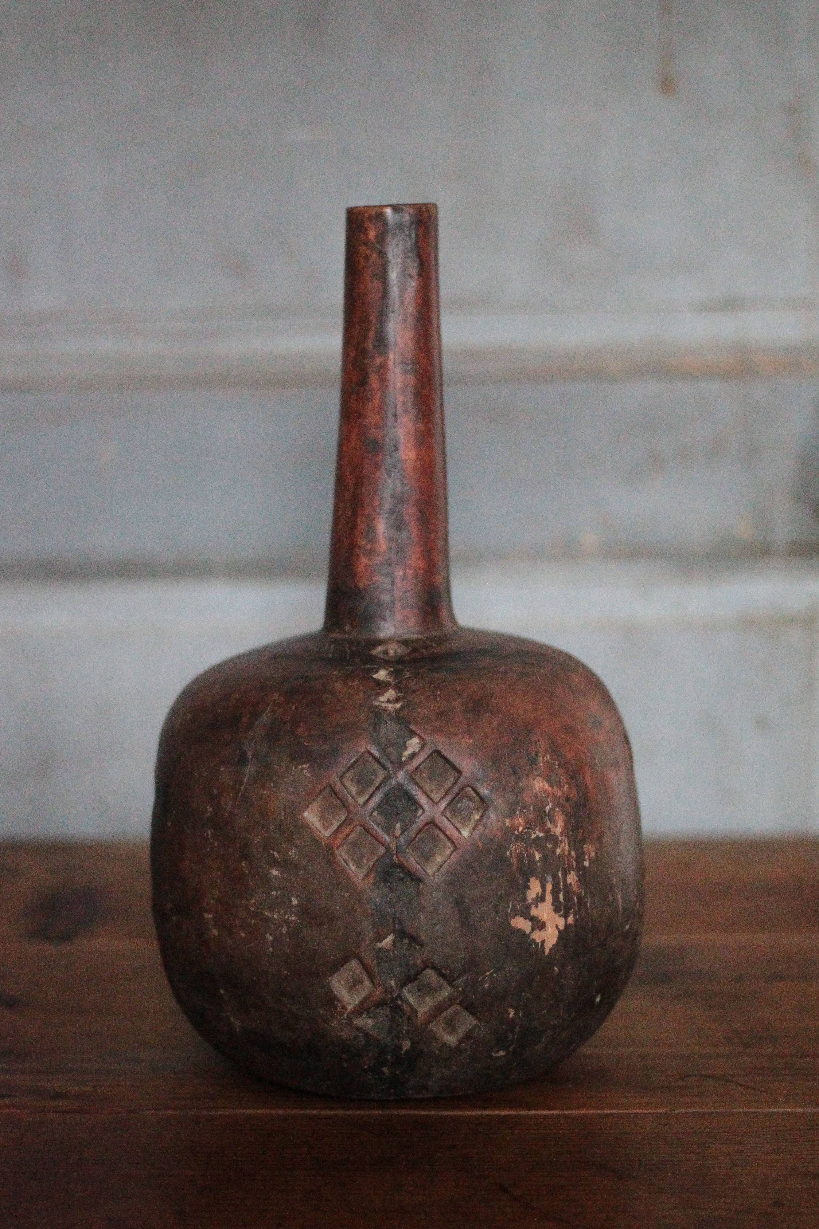 Vintage African wooden carved gourd bottle.