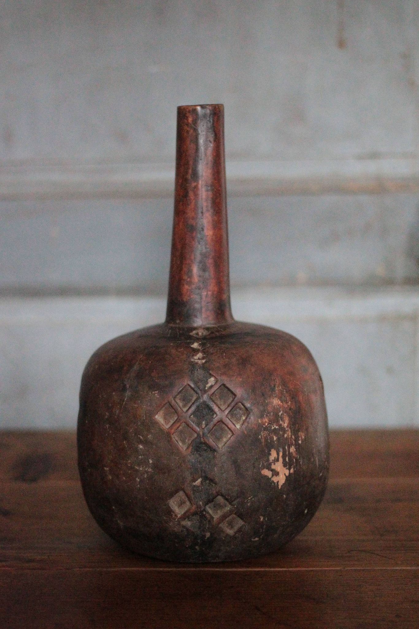 Vintage African wooden carved gourd bottle.