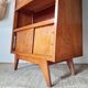 Vintage 1950s wooden secretary with tapered legs and mint interior.