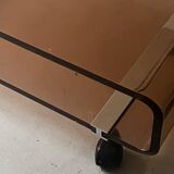 Smoked plexiglass coffee table on wheels, Roche Bobois design 1970.