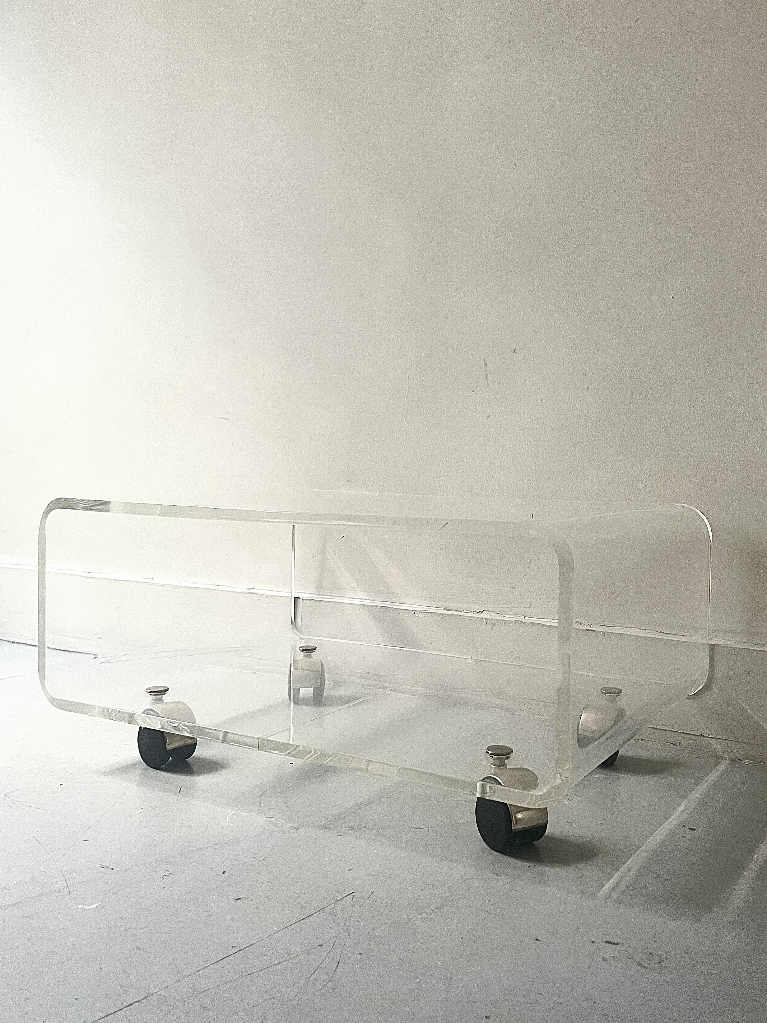 Transparent plexiglass coffee table by Roche Bobois, 1970s design.