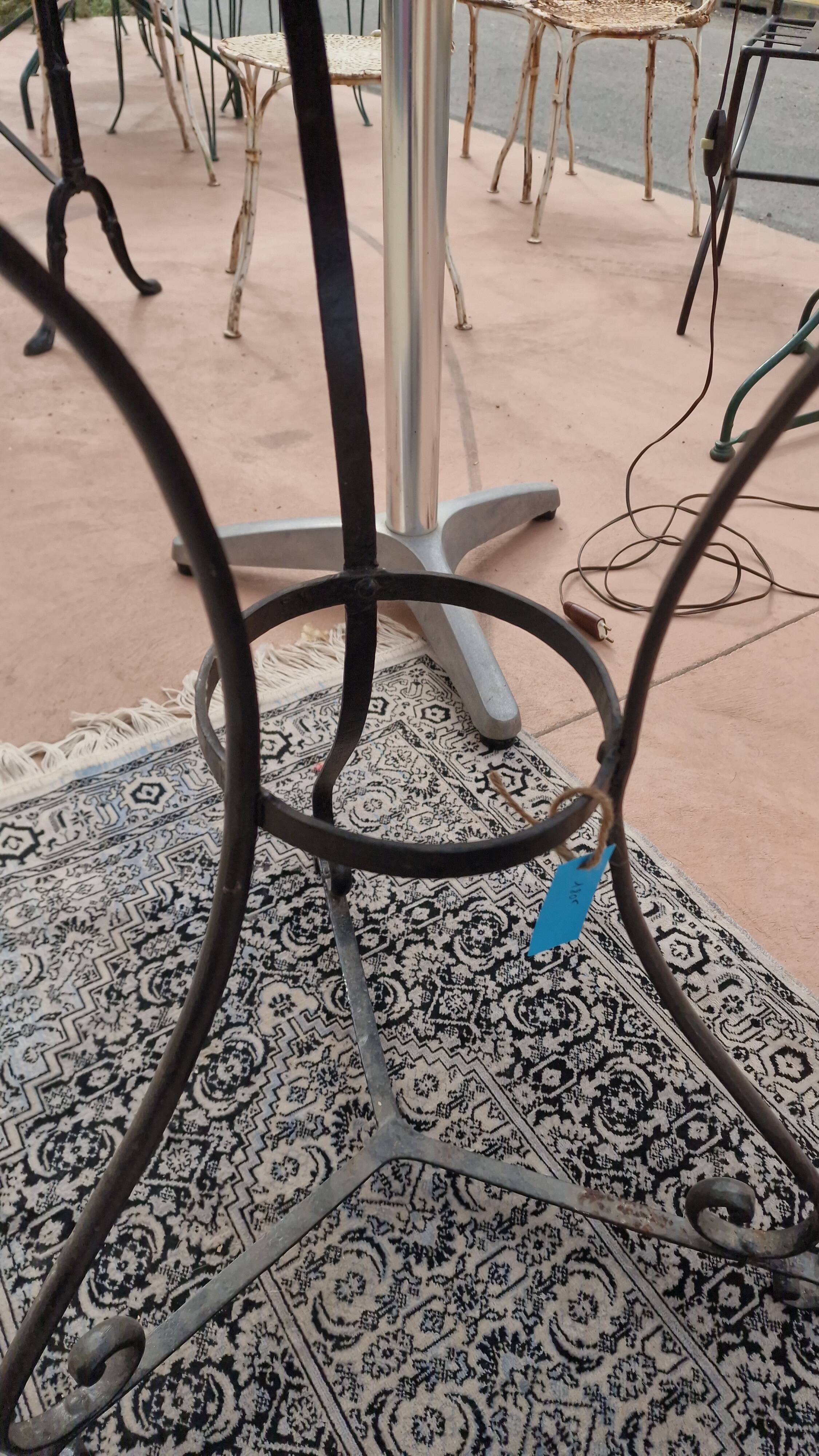 Round wrought iron and zinc bistro table