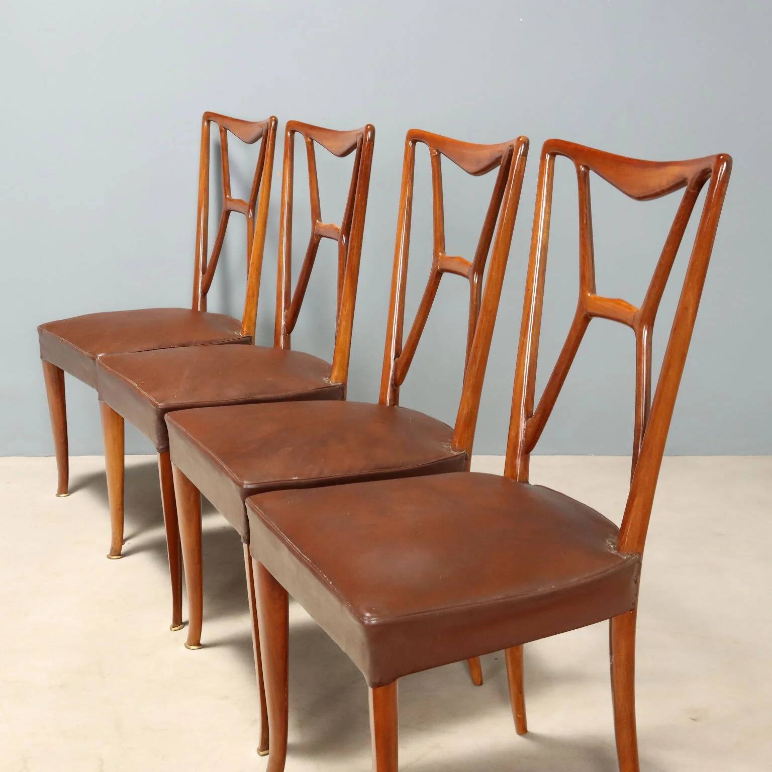 1950s chairs with wooden backs.