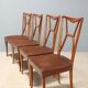 1950s chairs with wooden backs.