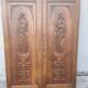 pair of antique solid oak cabinet doors with bird decor