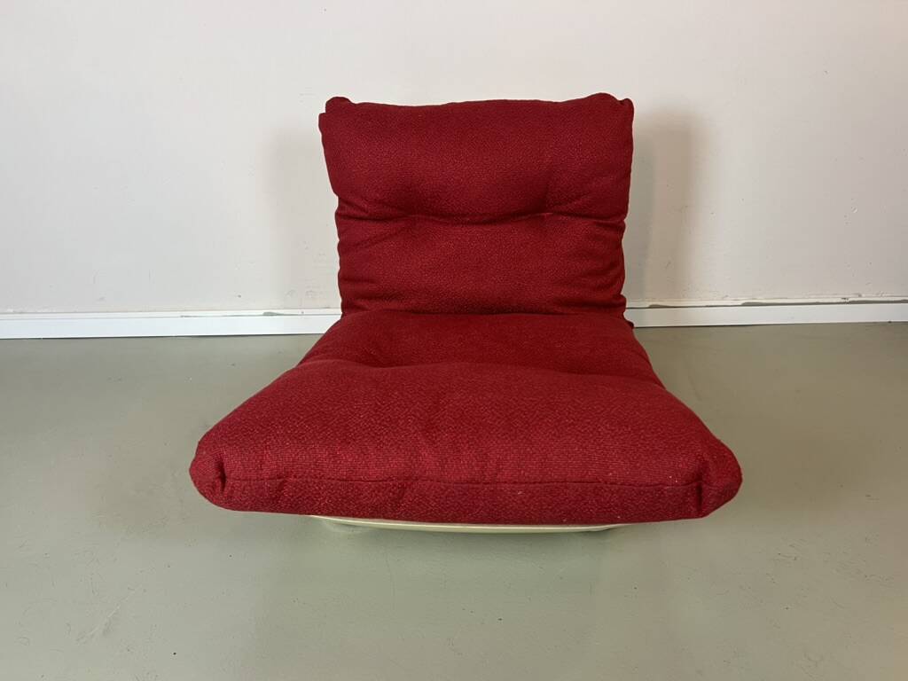 Vintage red shell lounge chairs from the 70s mid-century retro.