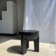Black mango wood tripod side table with a semi-spherical top, height: 45 cm, diameter: 44 cm.