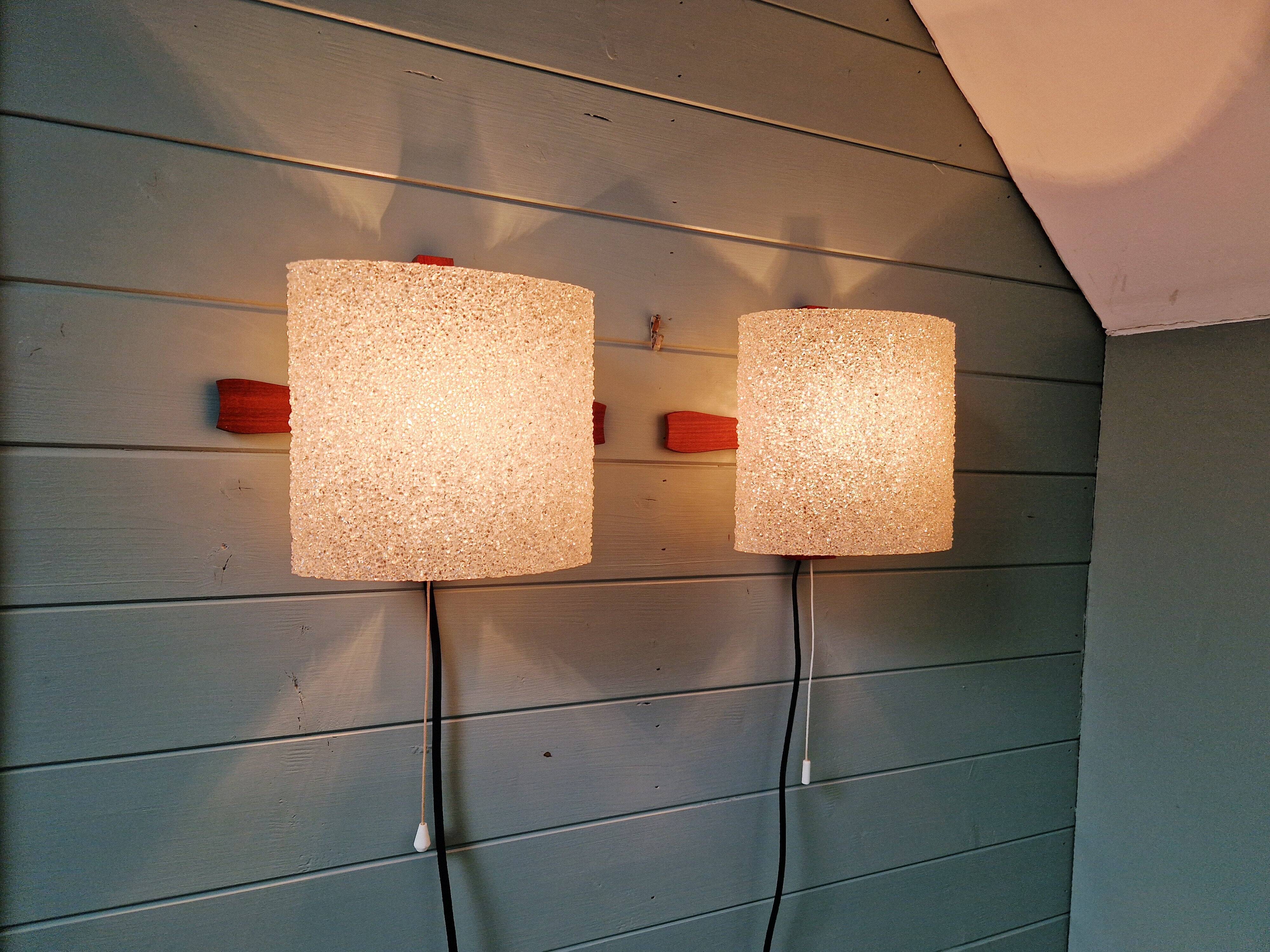 Pair of Scandinavian wall sconces in teak and plastic resin, 1960.