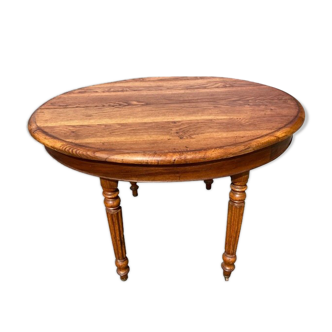 Oval solid oak table with 4 extensions