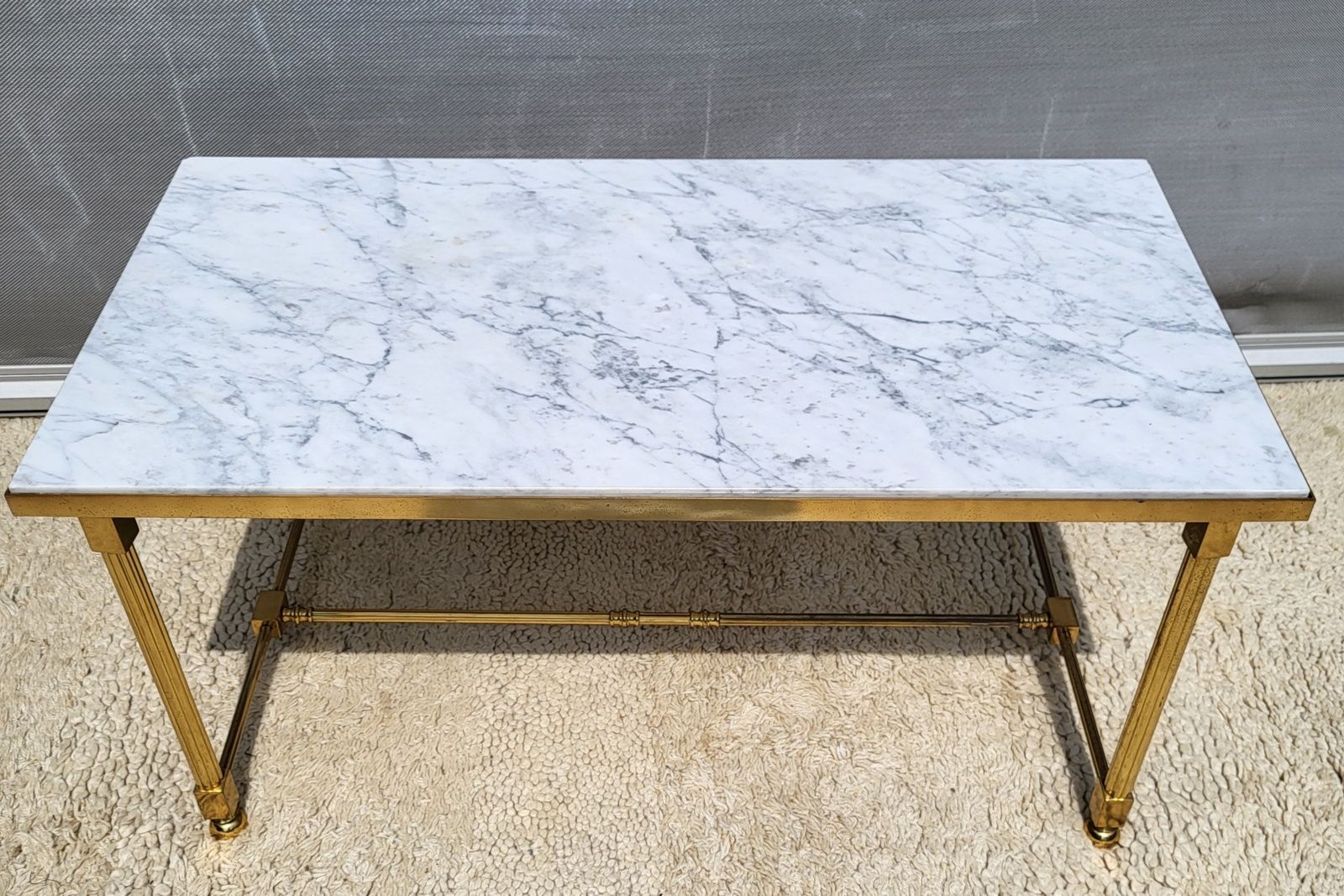 Hollywood Regency style coffee table • marble and brass