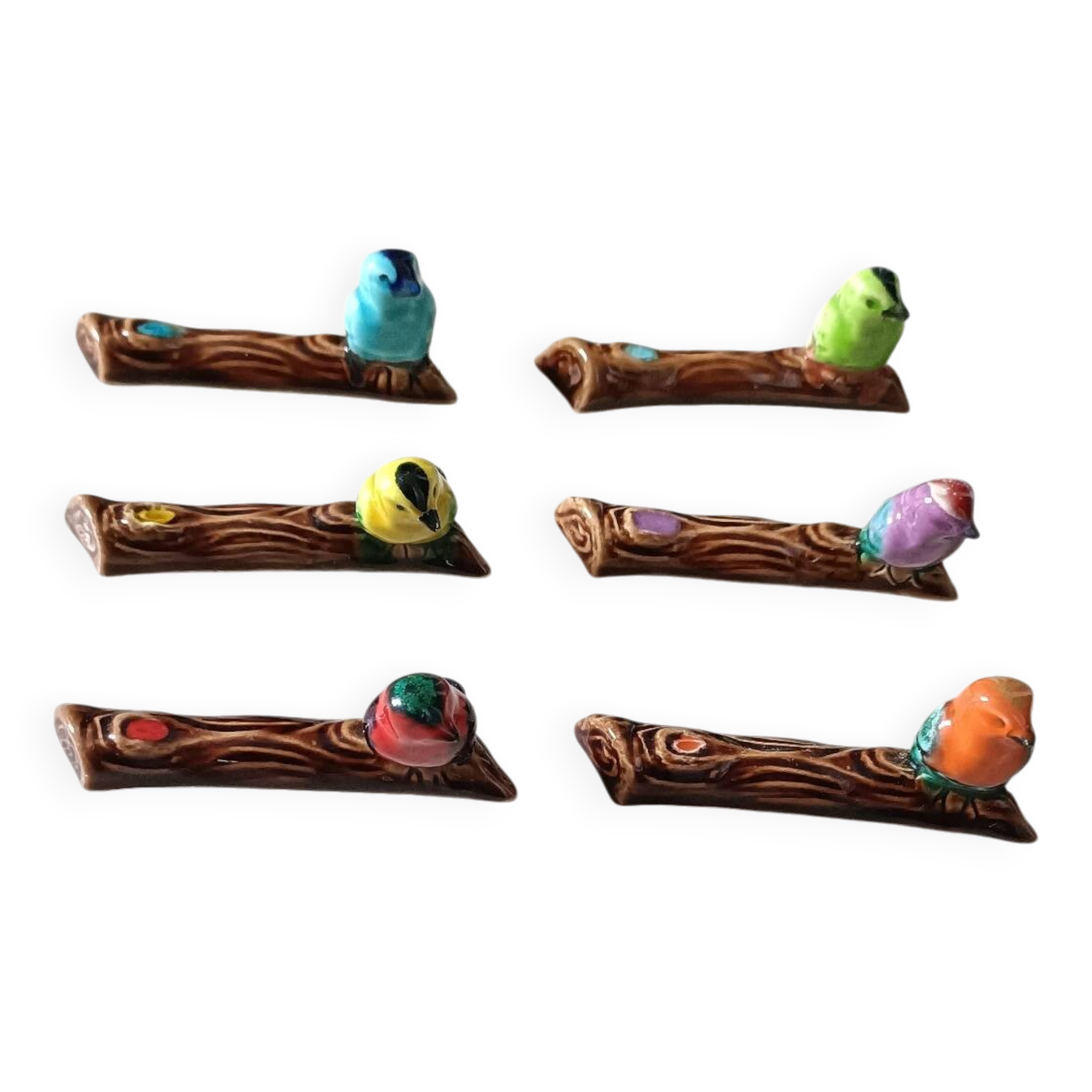 Set of six barbotine bird knife rests