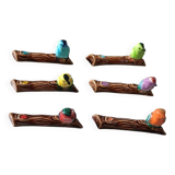 Set of six barbotine bird knife rests
