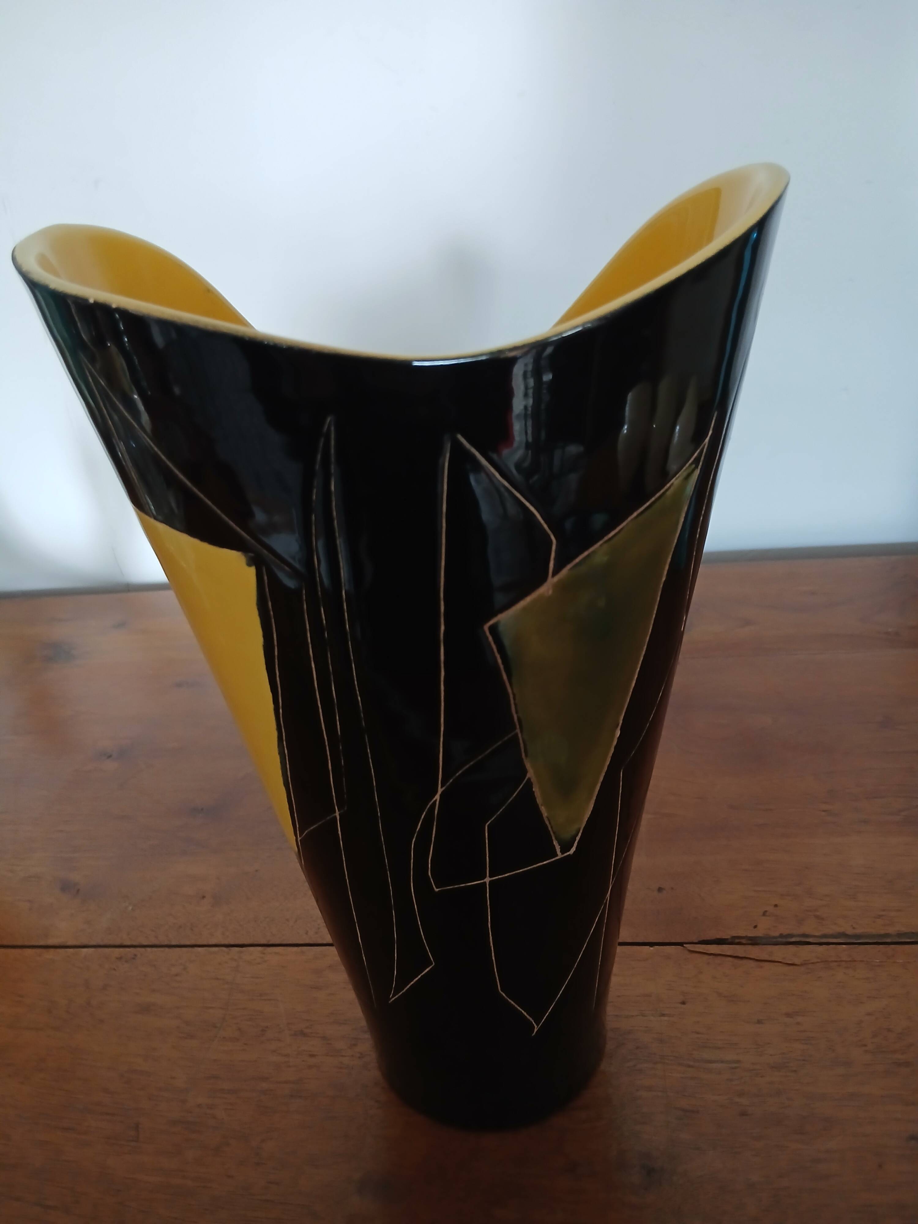 Yellow and black ceramic vase