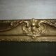 Miroir en bois et stuc redoré de style rocaille 33x29