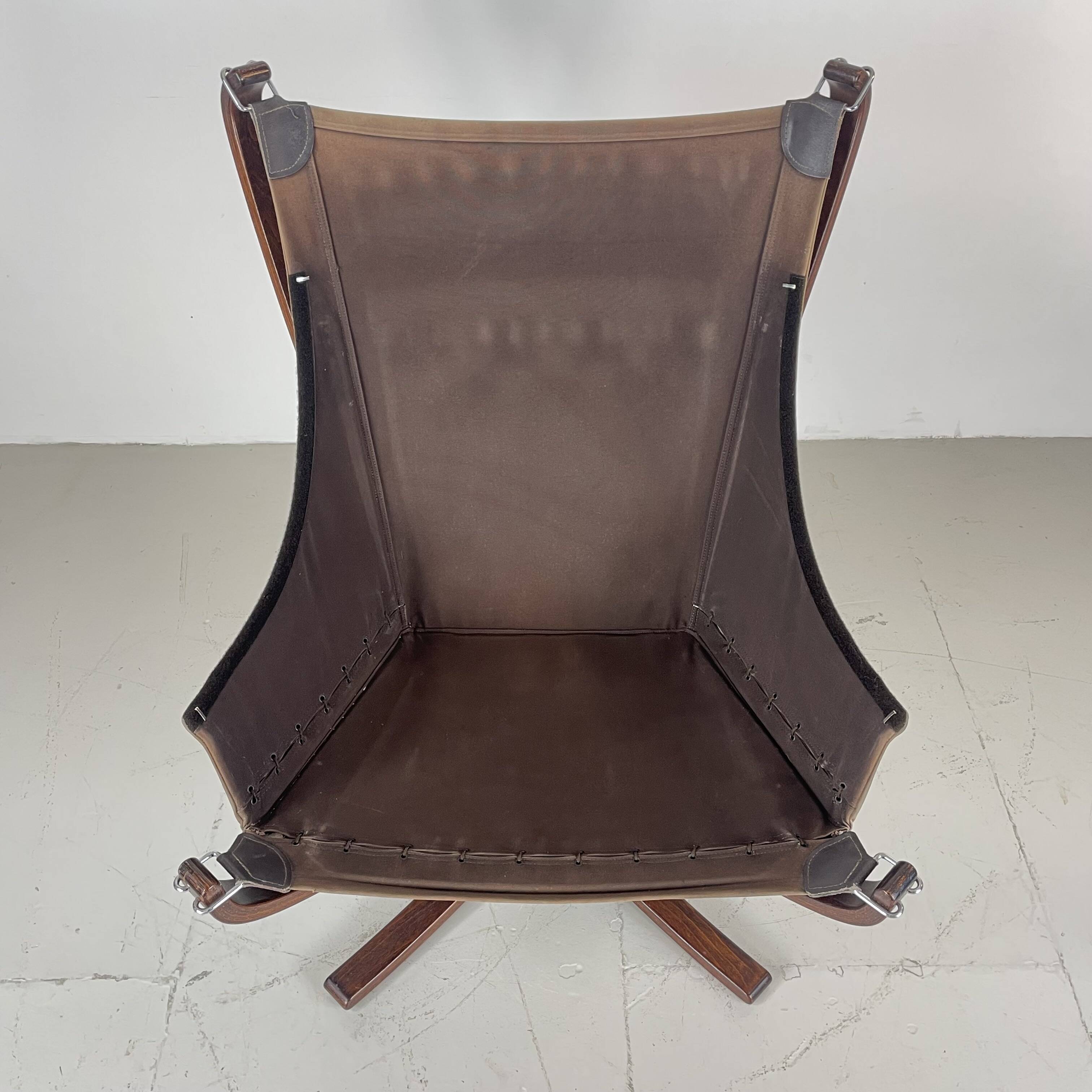 Vintage winged leather high backed Falcon chair designed by Sigurd Resell