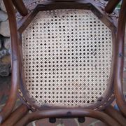 Curved wooden bistro chair with caning