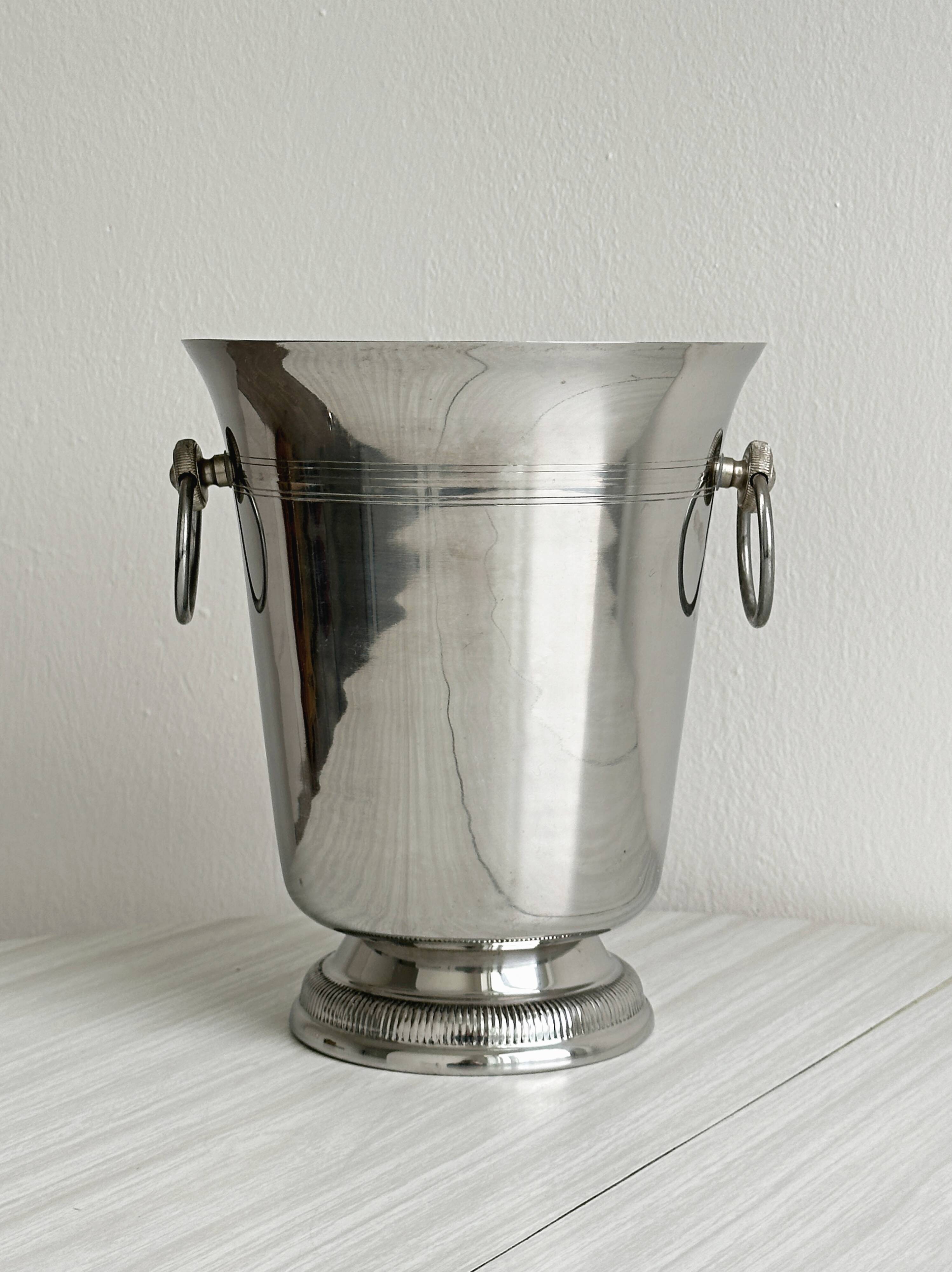 Shiny metal champagne bucket