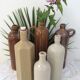 Old bottle in sandstone glossy with cove
