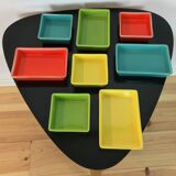 Black metal appetizer set with colorful ceramic ramekins