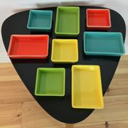 Black metal appetizer set with colorful ceramic ramekins