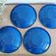 Set of 4 blue enamelled metal plates