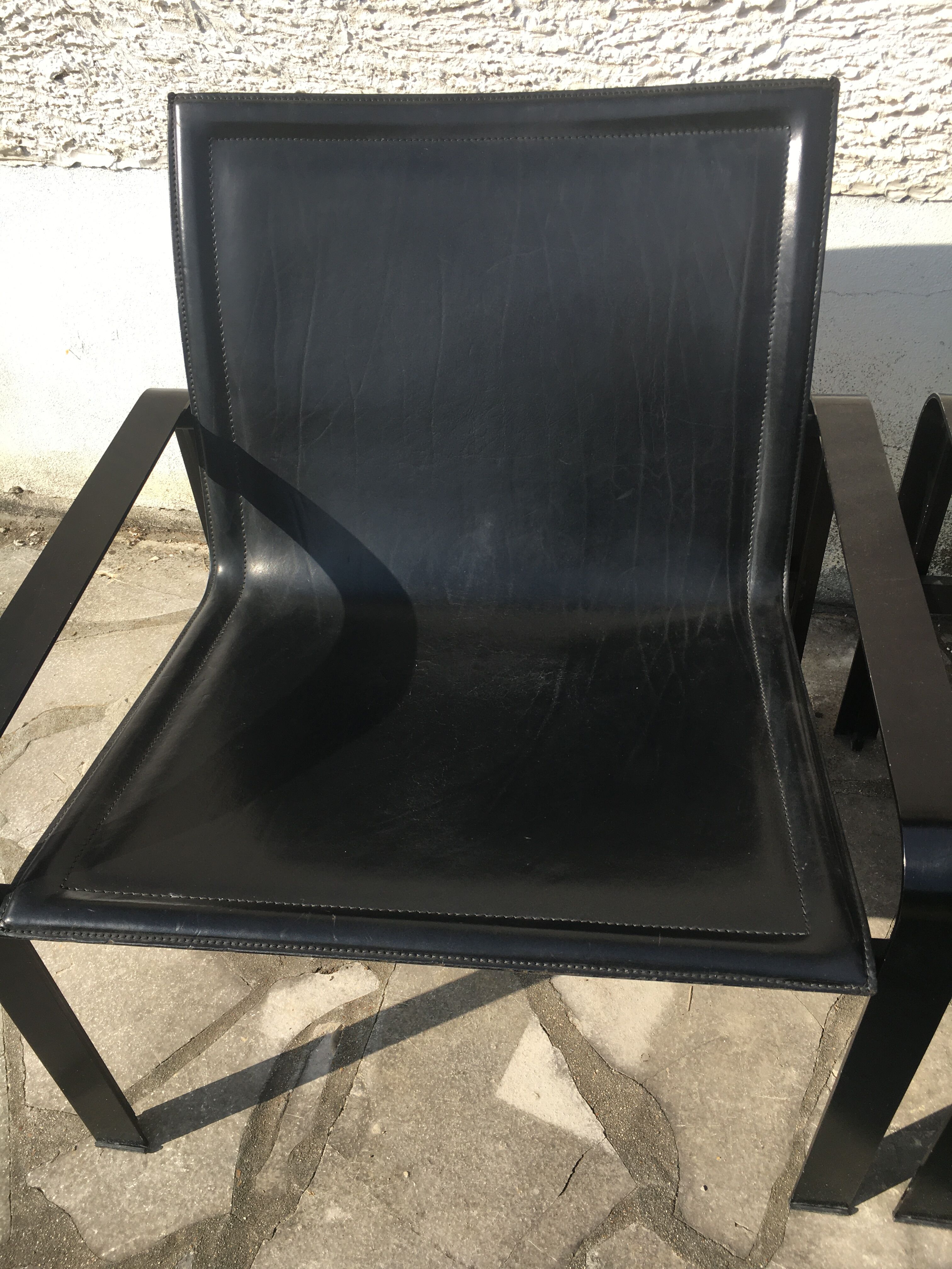 Pair of leather and metal chairs 70s