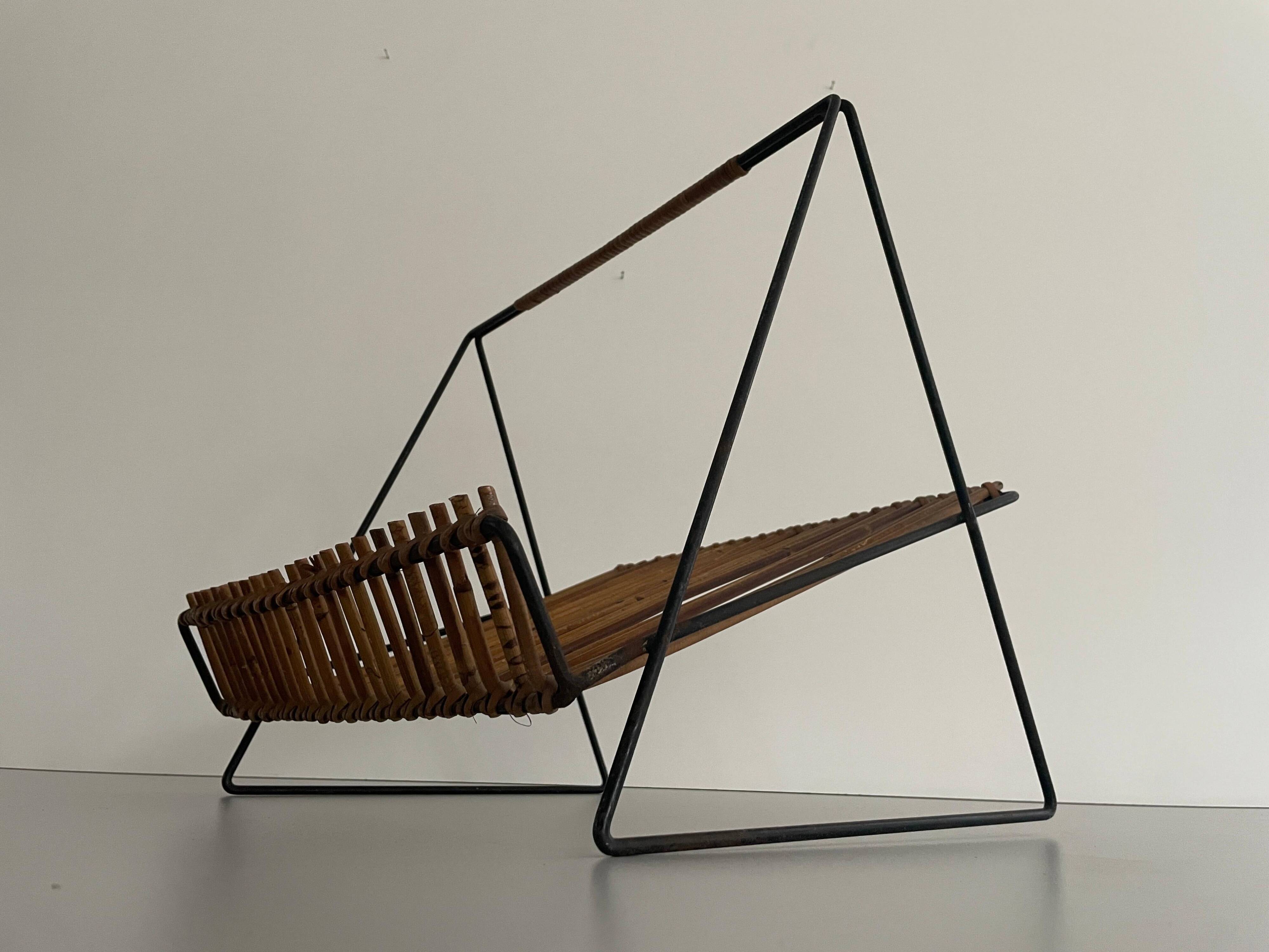 Mid-century black metal and rattan magazine rack, 1960, Italy