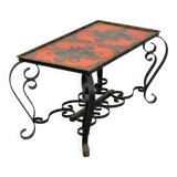 Vintage coffee table in glazed ceramic and wrought iron.