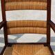 Armchair in stained oak and straw, French work from 1950.