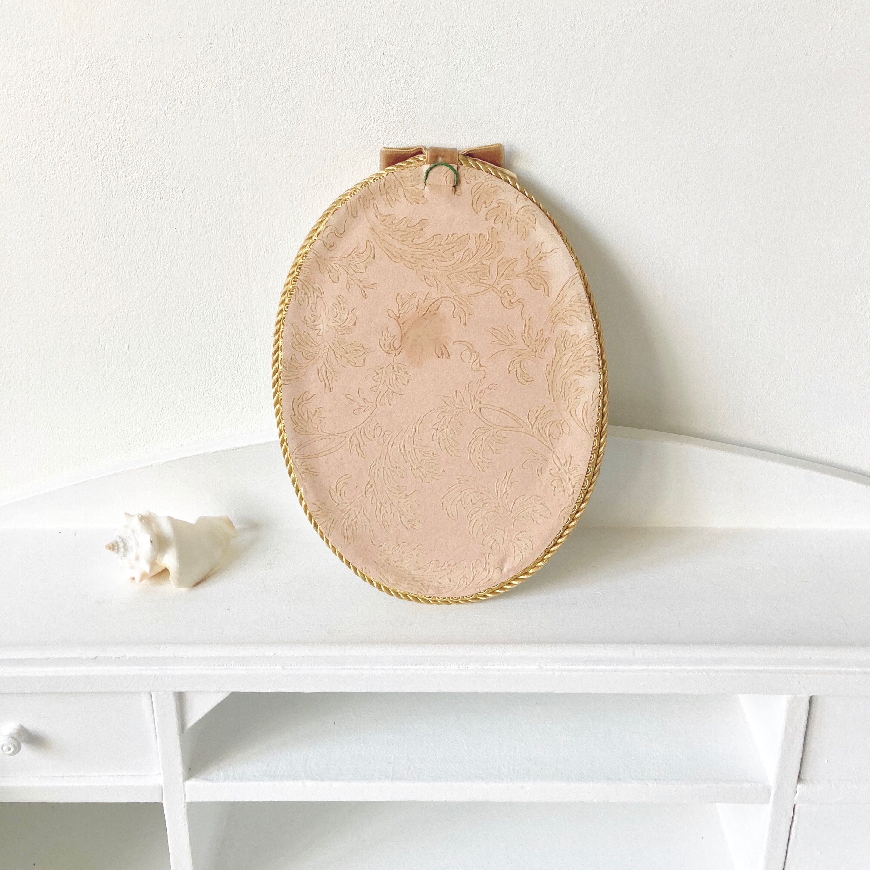 Frame domed glass flowers in fabric