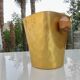 Gold anodised aluminium ice bucket, teak handles, signed T.L PARIS.