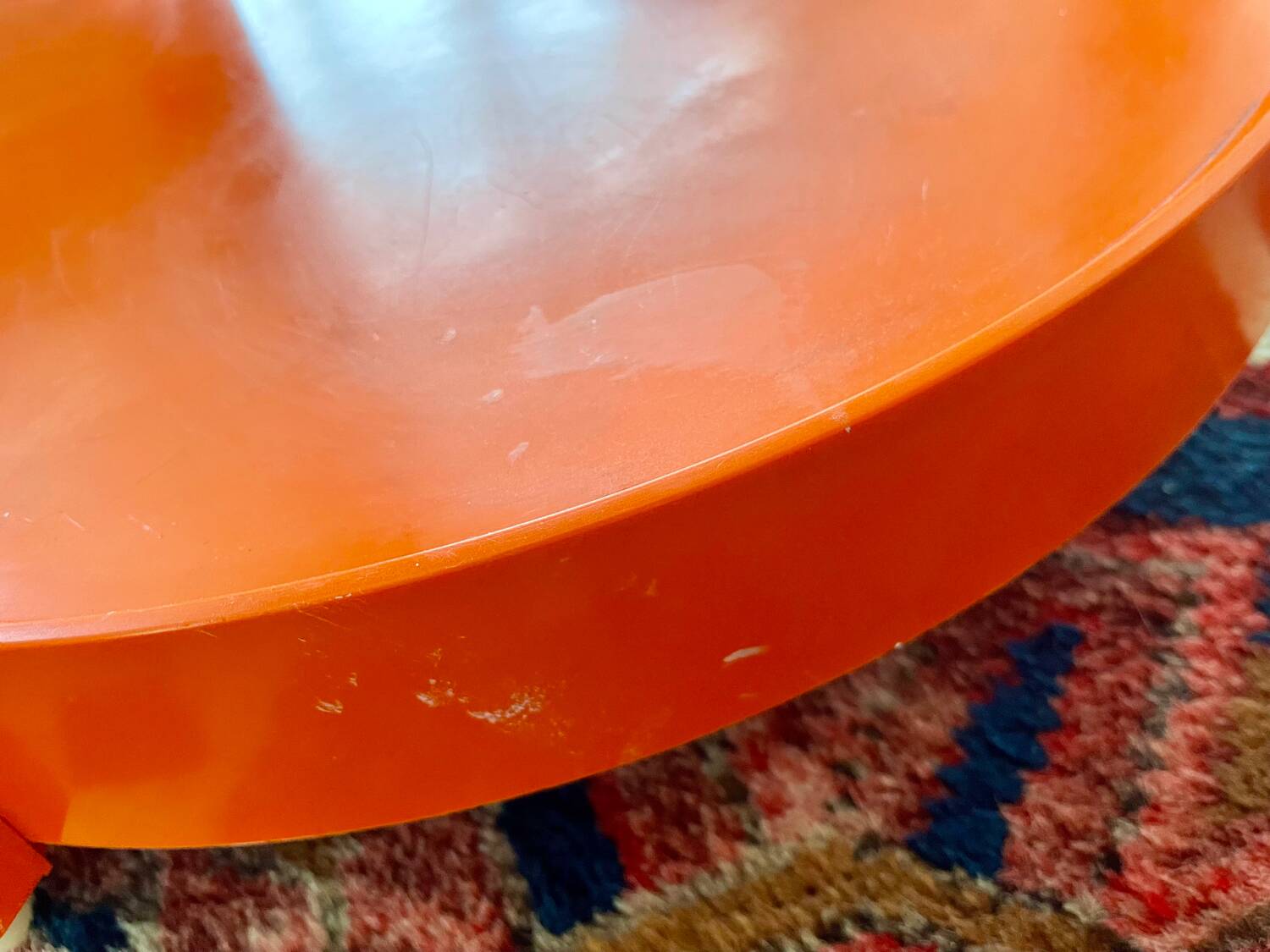 Round orange plastic side table 1970