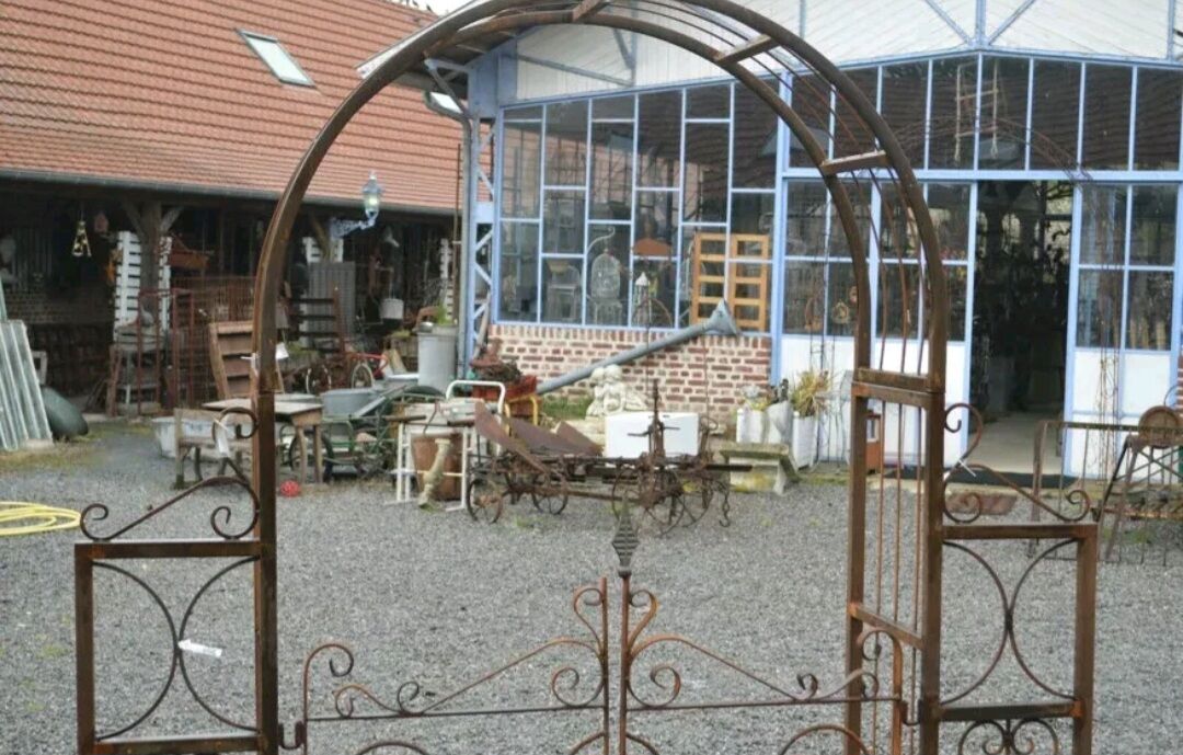 Garden arch with wrought iron gate