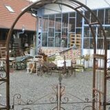 Garden arch with wrought iron gate