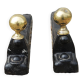 Old cast iron and xl brass andirons in neo classical style