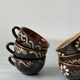 Lot of mismatched Alsatian pottery coffee cups