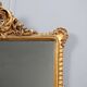 Antique Rococo-style mirror in carved gilded wood, 20th century.