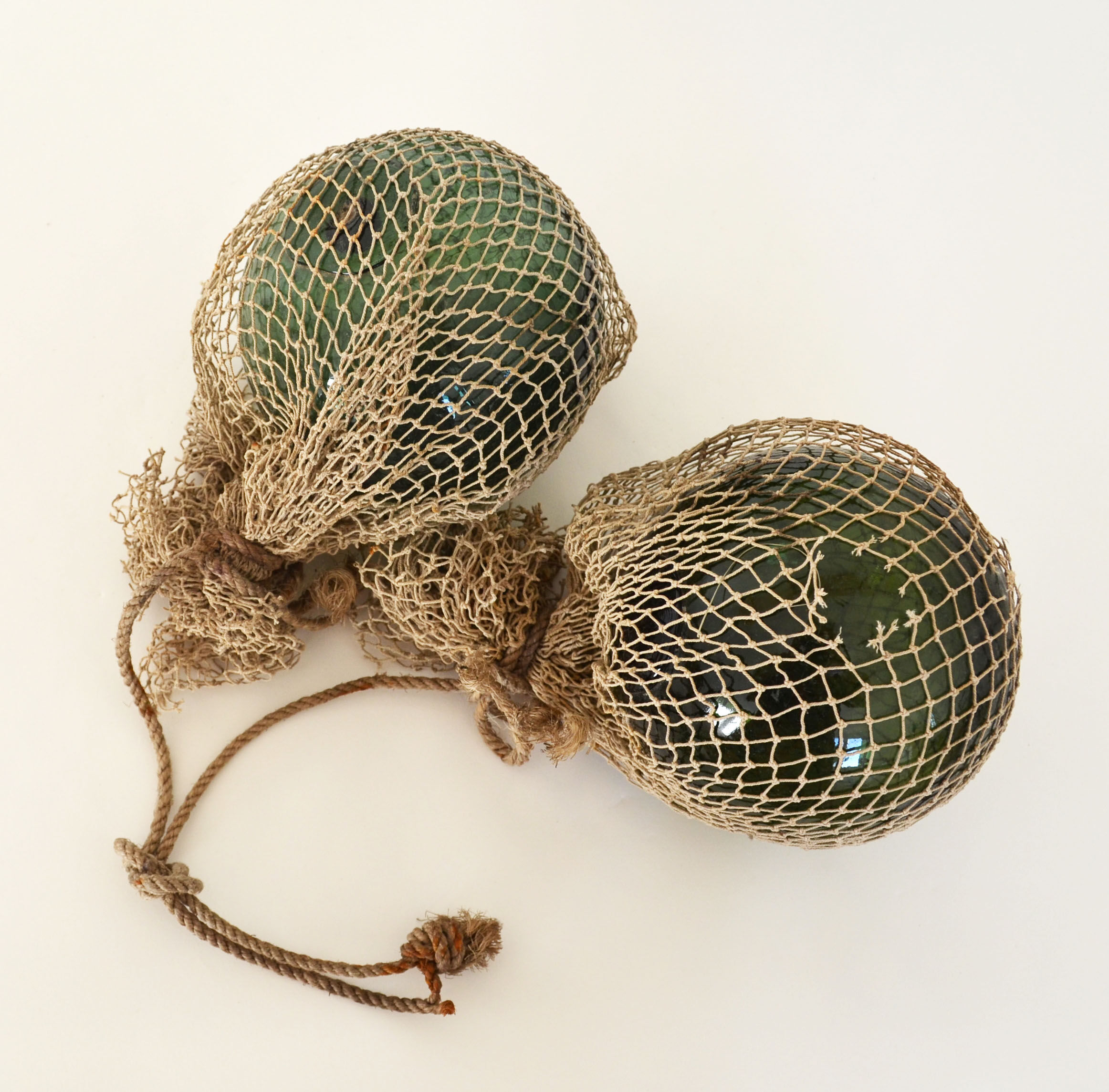 Two old glass floats