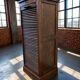 Vintage wooden filing cabinet with roller shutter