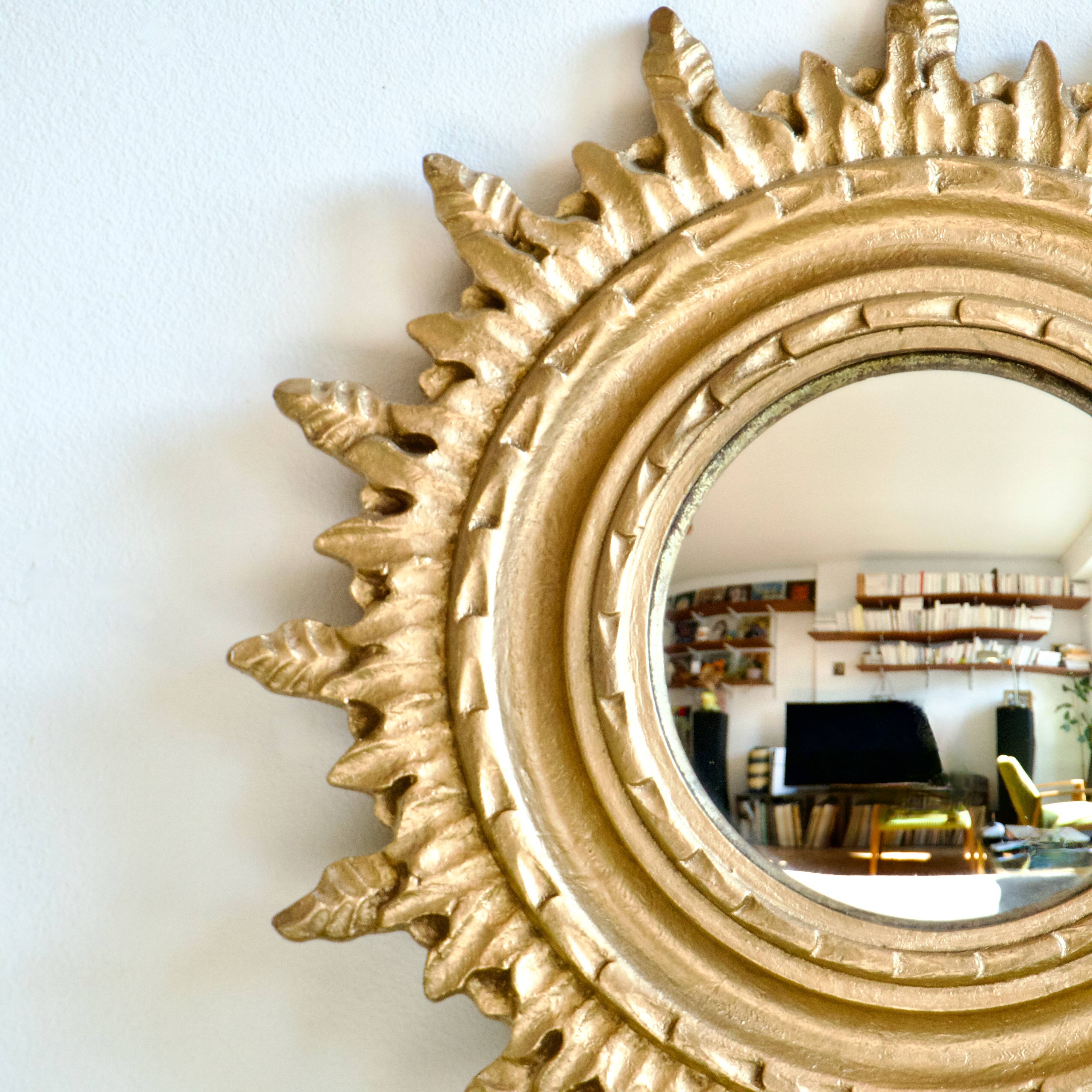 Ancien miroir doré oeil de sorcière soleil