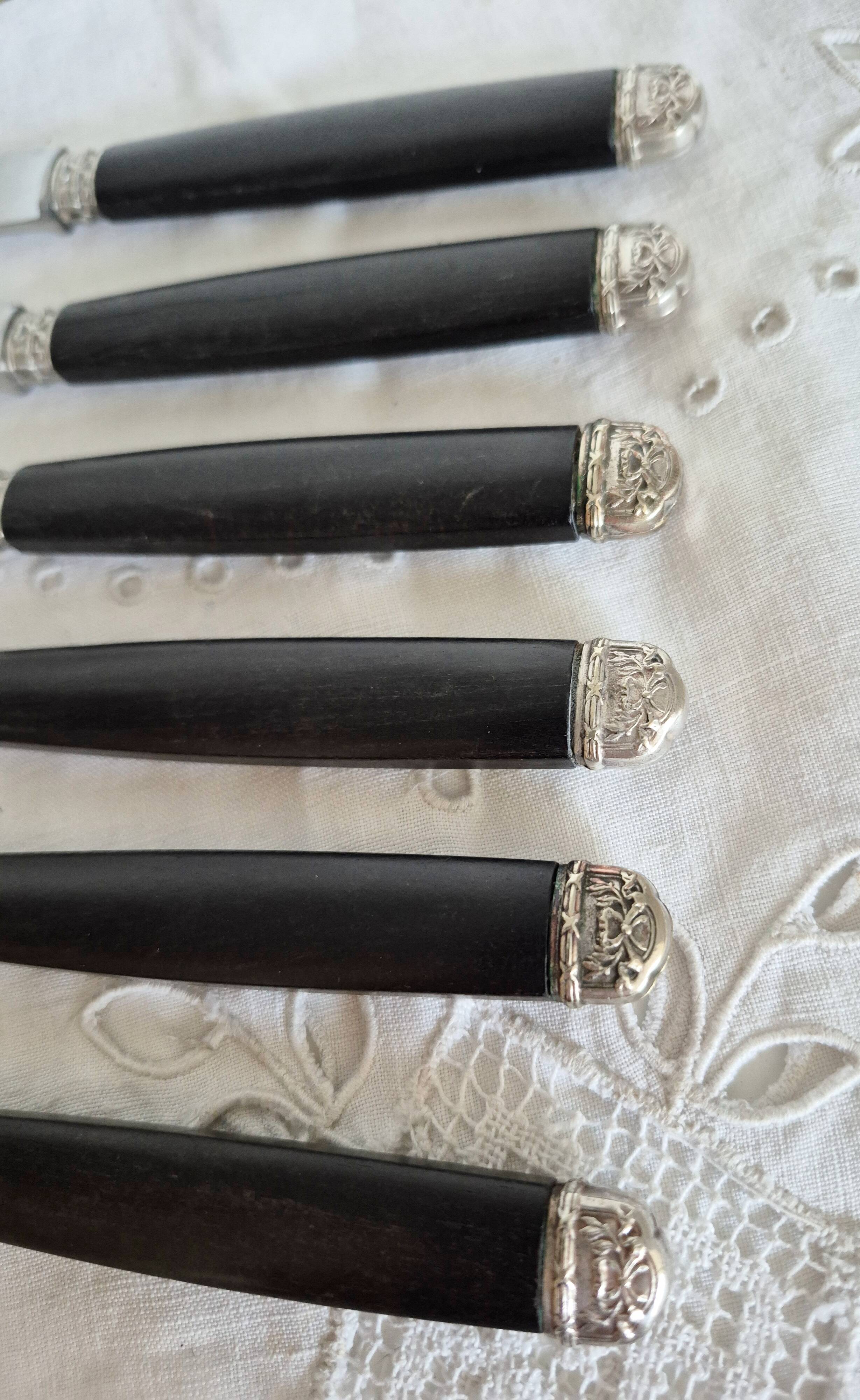 Silver and ebony cheese knives, stainless steel blade.