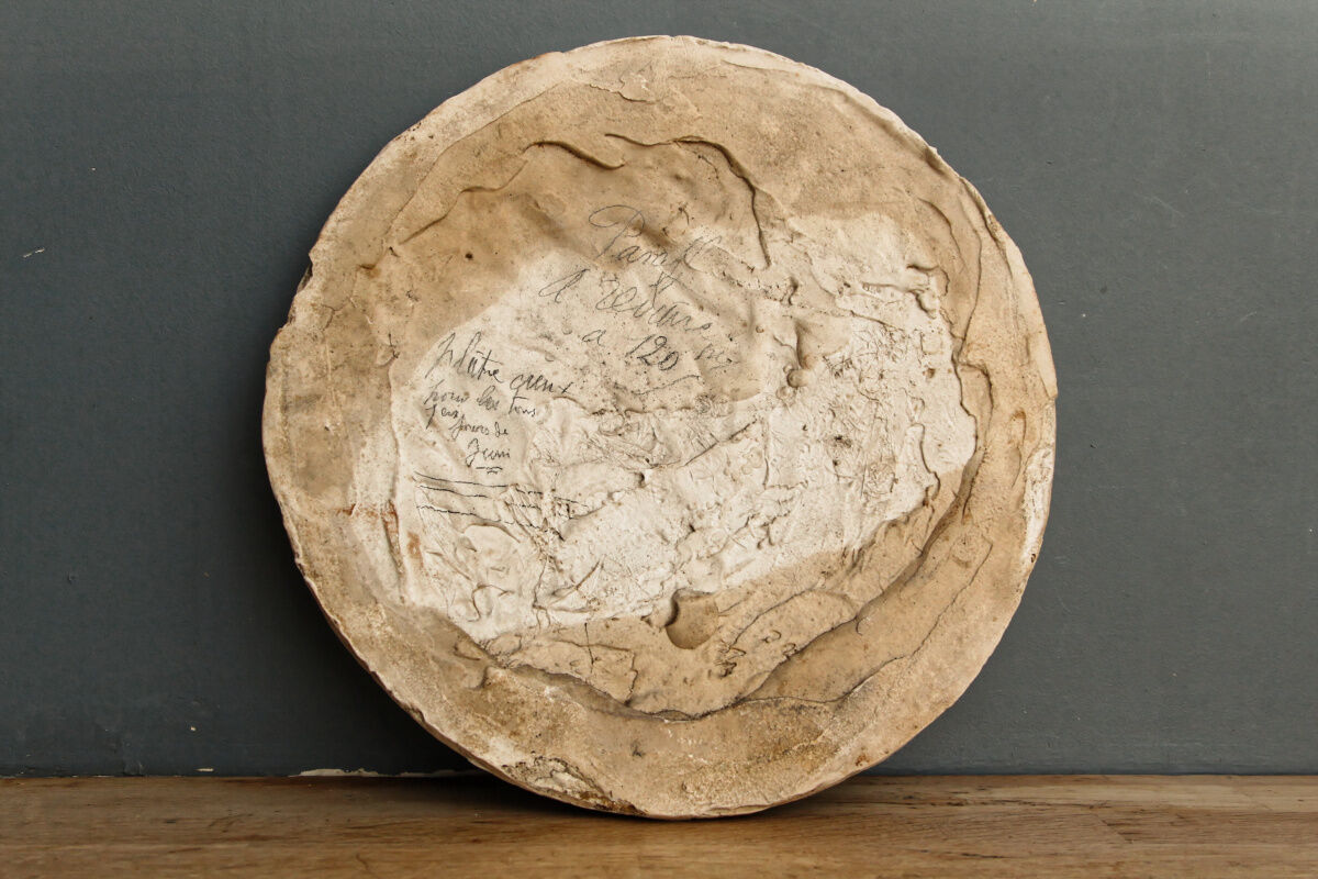 Old plaster medallion, man profile