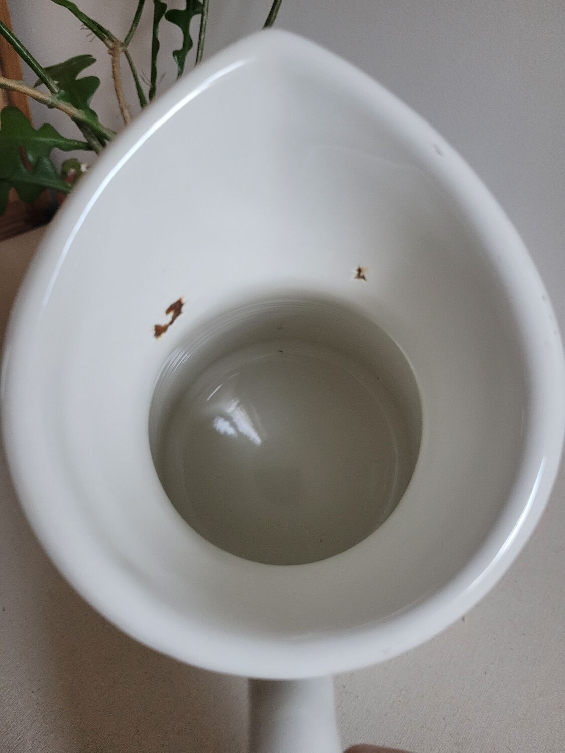 White enamelled metal jug