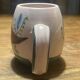 Set of two ceramic mugs signed Yvon ROY.