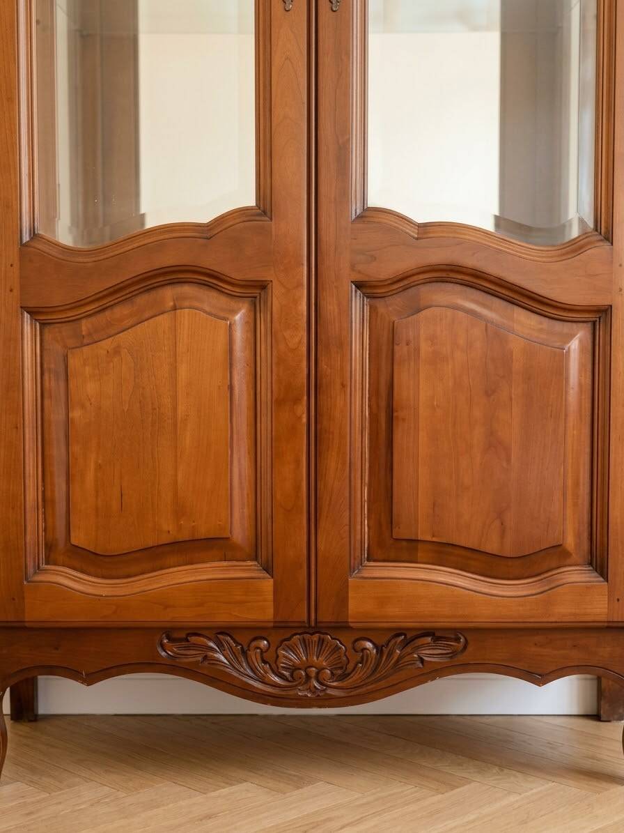Antique cherry wood display cabinet in Louis XV style