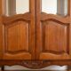 Antique cherry wood display cabinet in Louis XV style